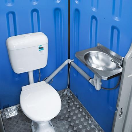 Ceramic toilet and stainless basin inside Sewer Connect unit